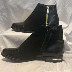 Black ankle boots. Not sure of brand name. Size 4,  like new, no scuffs.
